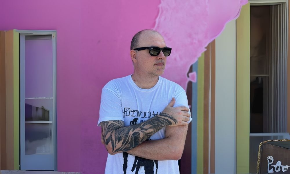 rodney standing behind a cool wall