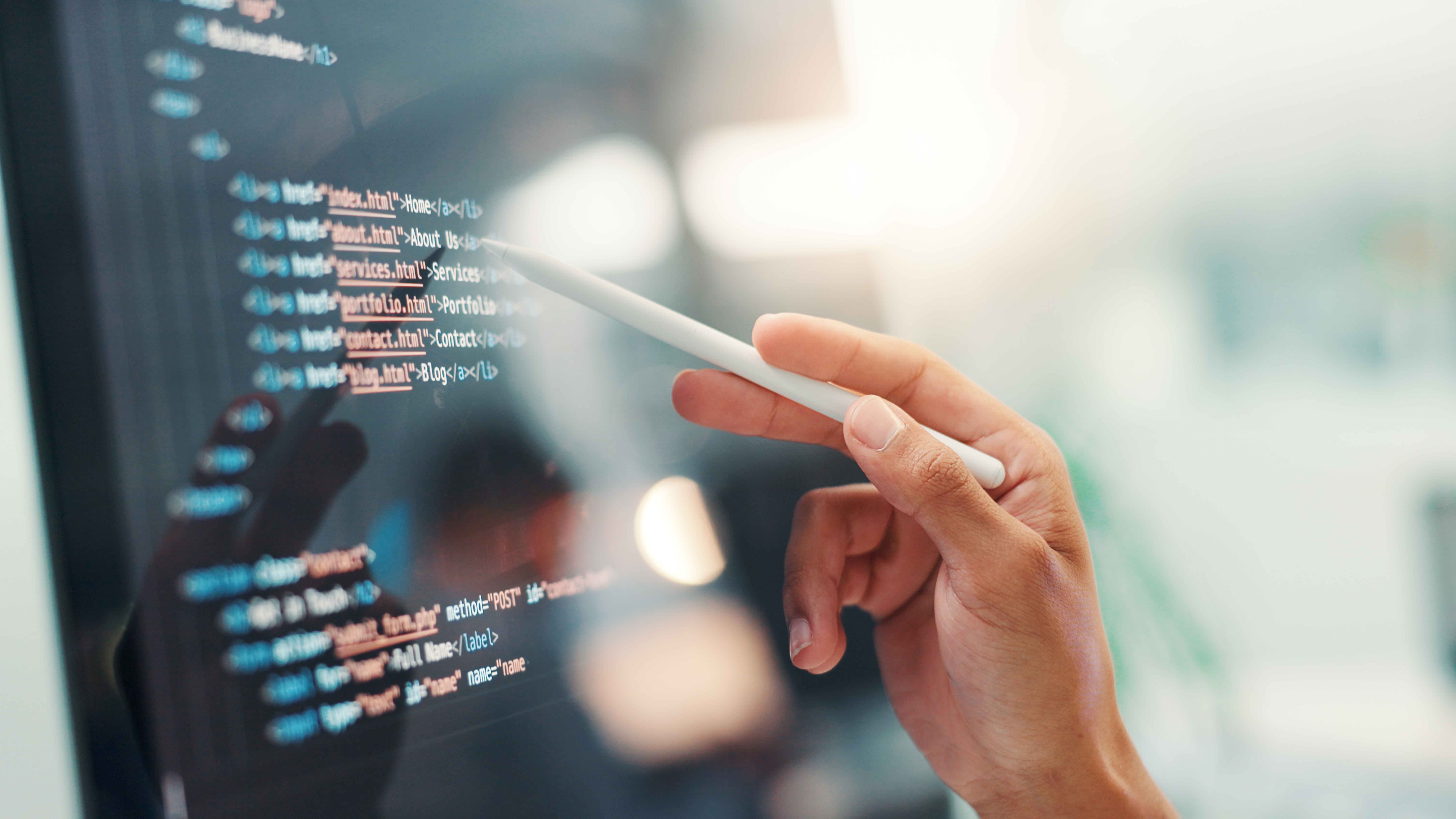 Programmer-hands-coding-on-screen