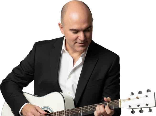 Rodney holding a guitar